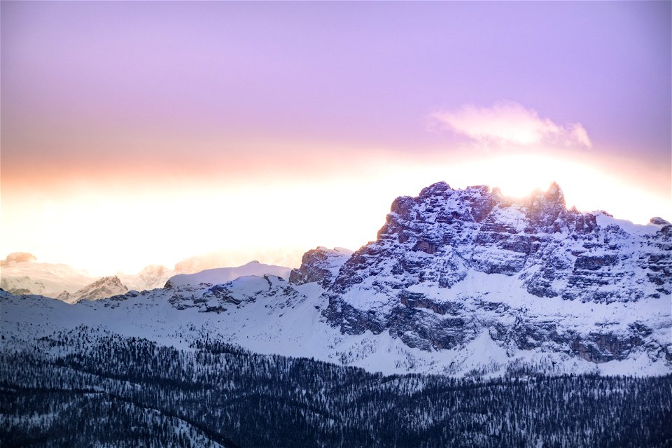 Mountain Cover By Snow Under Orange Sky