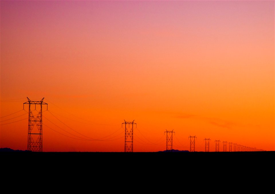 Photo Of Electric Posts During Sunset photo