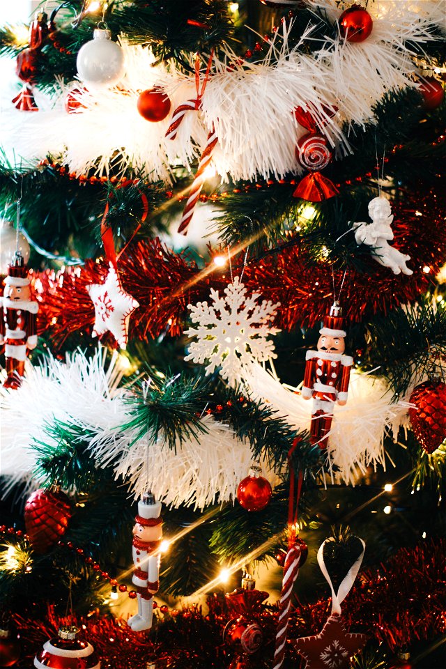 Green Christmas Tree With String Lights And Hanging Decors