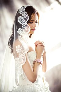 Woman In White Bridal Gown Meditating photo