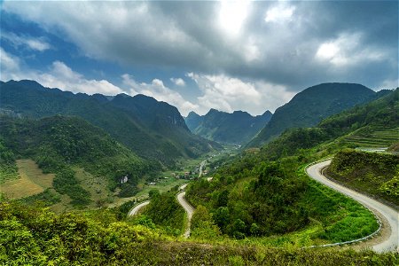 Road Near Mountain Under Cloudy Weather photo