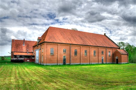 Brick Farmhouse In Field photo
