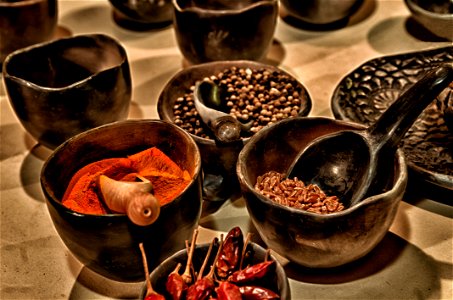 Black Ceramic Bowl With Different Kinds Of Condiments photo