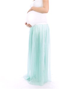 Pregnant Woman Standing In Front Of White Wall photo