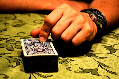 Person Holding Playing Cards photo