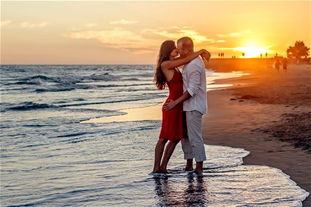 Romantic Couple Kissing On Beach photo