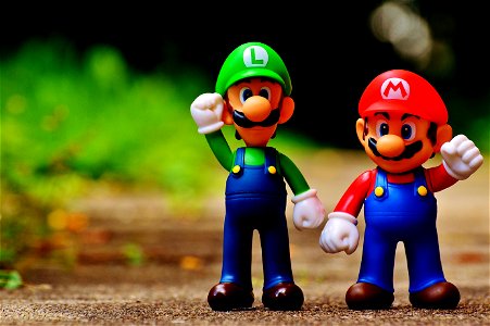 Macro Photography Of Mario And Luigi Plastic Toy