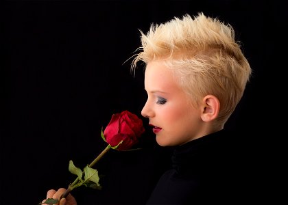Woman Holding Red Rose photo