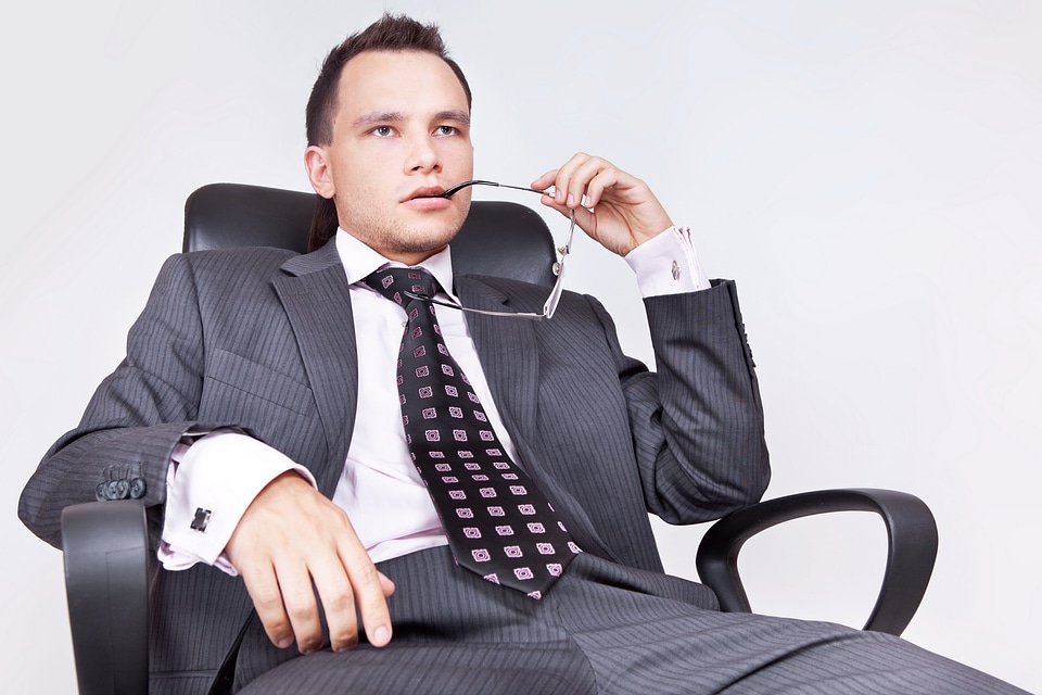 Young Businessman thinks