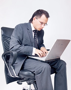 Businessman using laptop photo