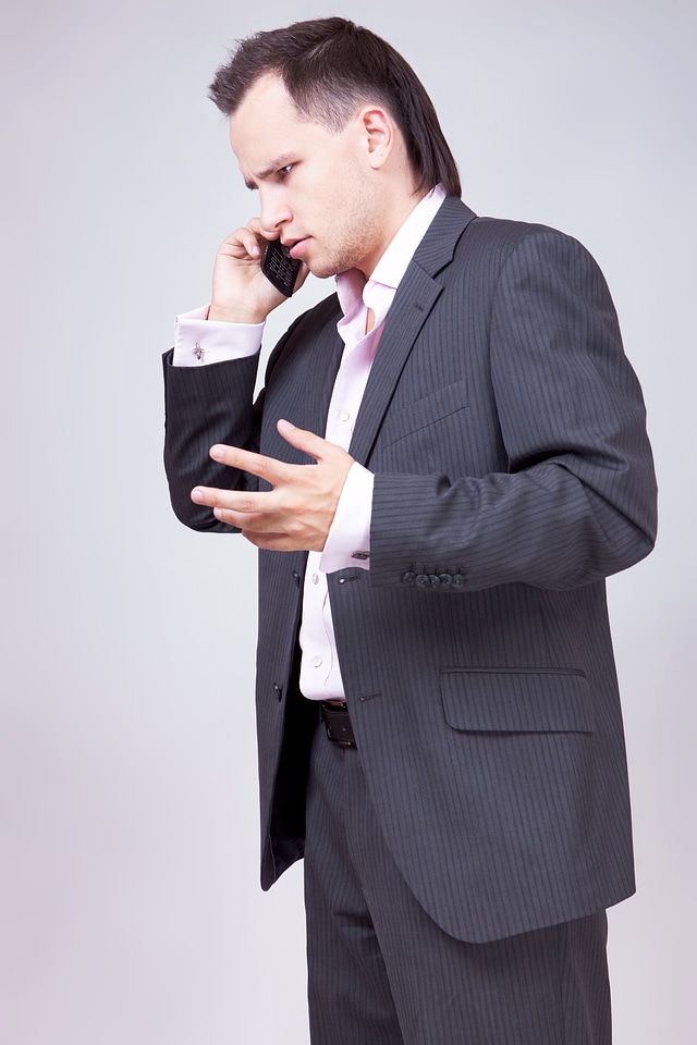 Businessman talks with expression