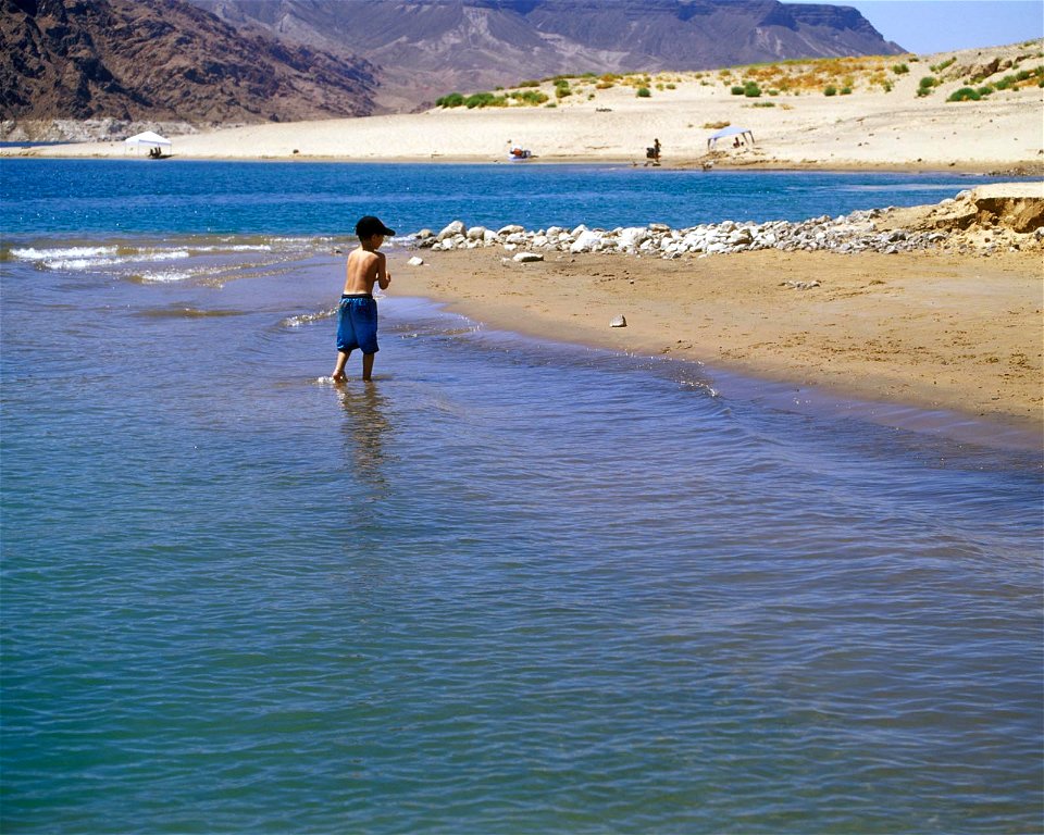 a young boy takes advantage of a beach area at Lake Mead photo