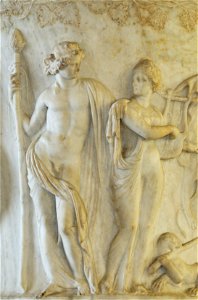 Dionysos wearing the mitra and holding a thyrsus with Ariadne playing the kithara; detail of the side A from the Borghese Vase. Pentelic marble, Attic work, ca. 40–30 BC. Found in 1569 in the Horti Sa