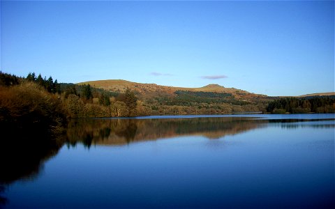 The view from the dam of Burrator Reservoir looking north-eastwards to the tors of Sharpitor and Leather Tor on Dartmoor, England. With an aspect ratio of 8:5, 16:10, or 16:9, this image is suitable a photo