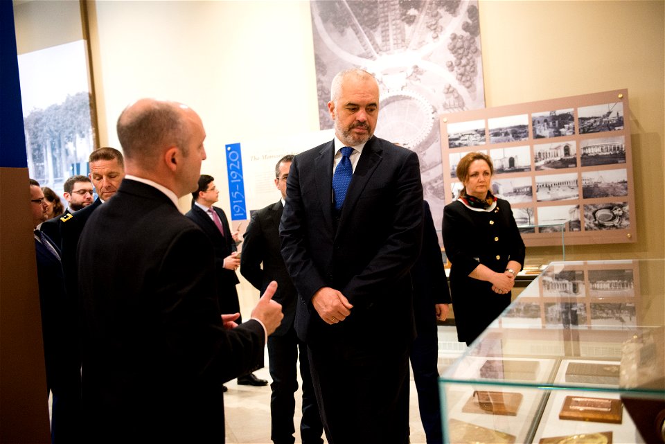 Prime Minister of the Republic of Albania Edi Rama, center, receives a tour of the Memorial Amphitheater Display Room from Christopher Warren, left, one of Arlington National Cemetery’s historians, Ap