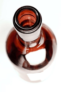 Brown glass bottle top view photo