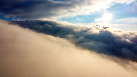 Sunlight Above Clouds photo