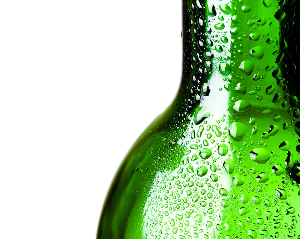 Glass bottle with water drops