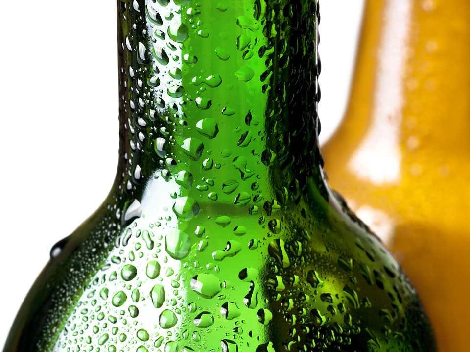 Glass bottles with water drops