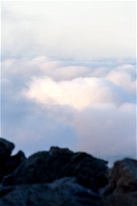 Rocky Summit Overlooking Clouds photo