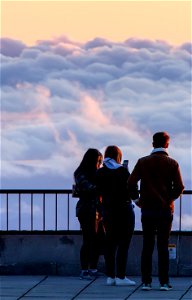 People Standing Above Clouds photo