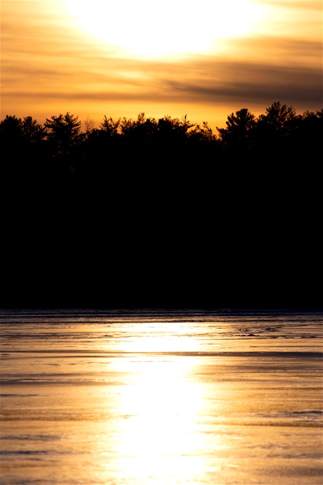 Sun Reflected on Frozen Lake photo