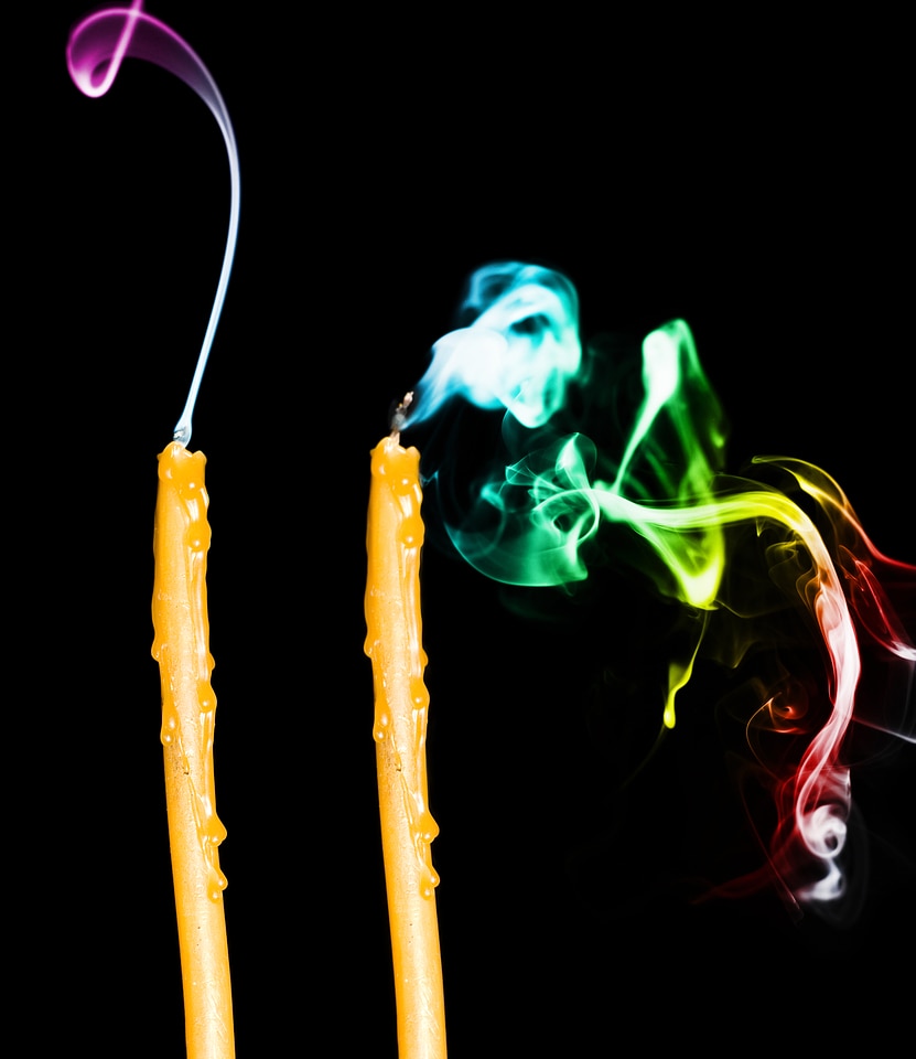 Candles with multicolored smoke
