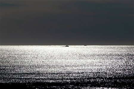 Small Boat on the Horizon, Black and White photo