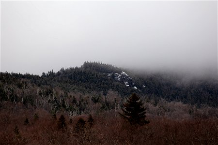 A Touch of Snow on Foggy Hillside photo