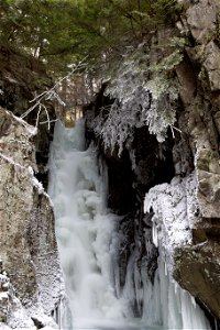 Frozen Waterfall Amongst Cliffs photo