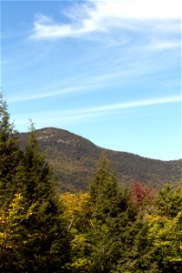 Rolling Green Mountain Under Blue Sky photo