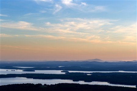 Hazy Sunset Over Lakes and Mountains photo
