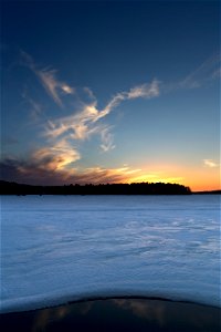 Sunset Over Frozen Landscape photo