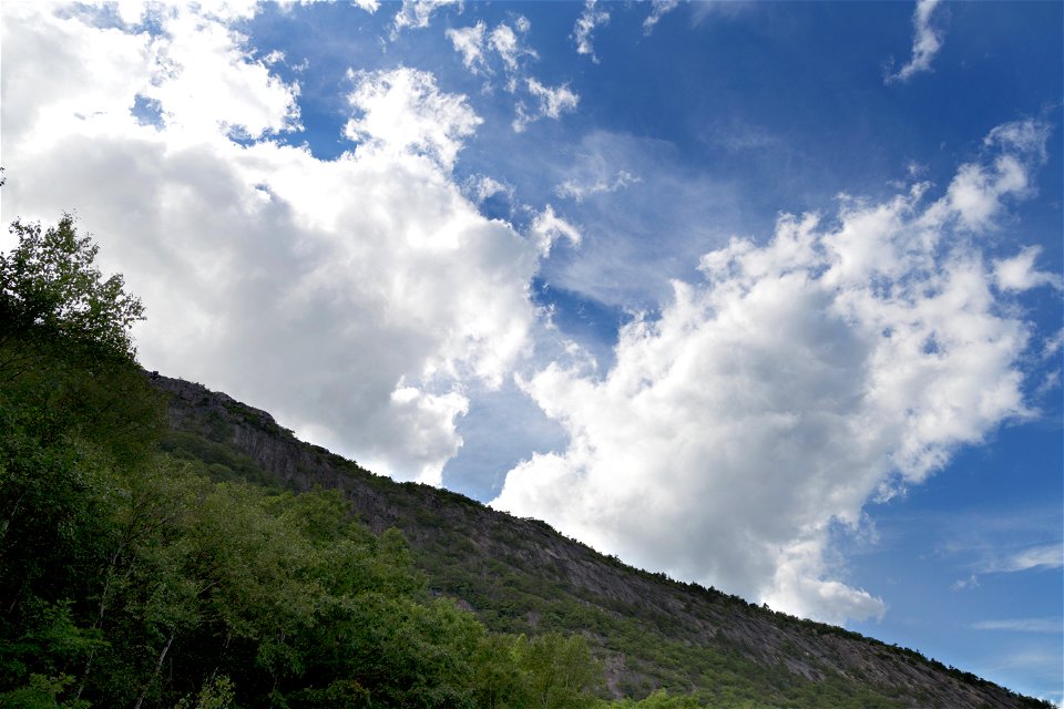 White Clouds and Green Mountain Slope photo