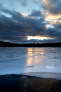 Sunlight Reflected on Icy Lake photo