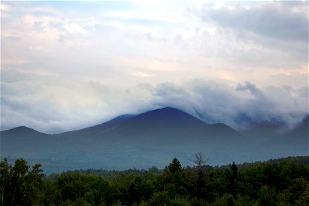 Thick Cloud Cover Rolling Over Mountains photo