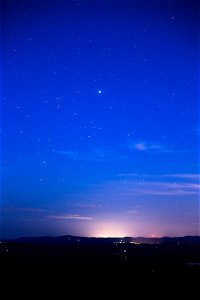 Brilliant Blue Night Sky and Bright Horizon photo