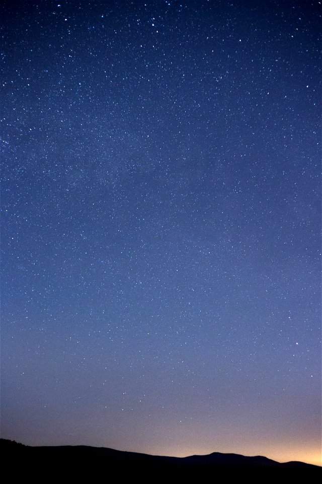 Sliver Mountain Silhouette Under Night Sky photo