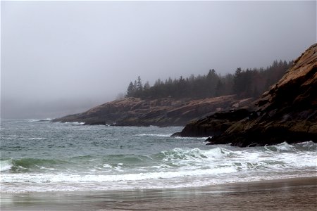 Waves Rolling onto the Beach and Rocky Shore photo
