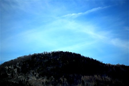 Hill Under Pale Blue Sky