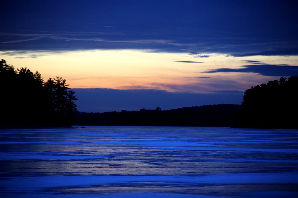 Frozen Lake Reflecting Sunset Sky photo