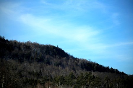Faint Clouds Over Hillside photo