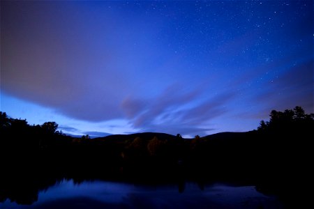Dark Horizon Under Blue Night Sky photo