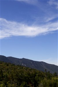 Thin Wispy Clouds Over Mountain Ridge photo