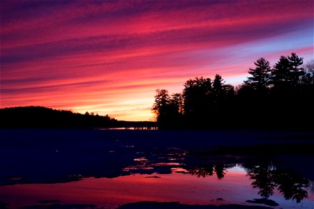 Vibrant Sky and Lake Reflection photo