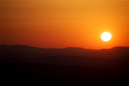 A Warm Sunset Over Mountains photo
