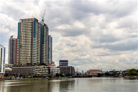 Tall Buildings On River Banks In Manila photo