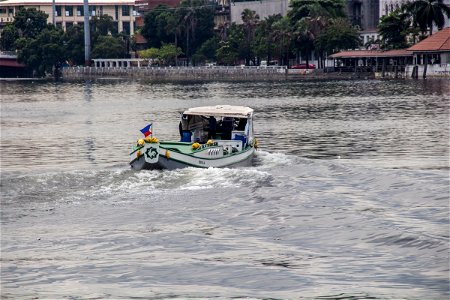 Motorboat On Water Near Shore In Manila photo