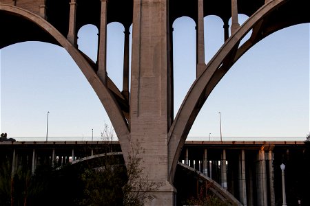 Arch Bridge Behind Concrete Abutment photo