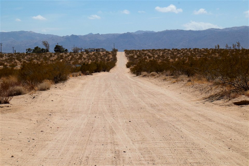 Hills Beyond Empty Dirt Road